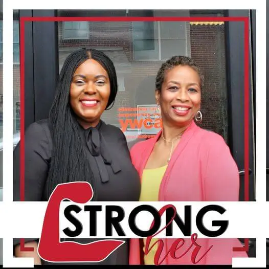 Latasha Humphrey and Valerie Johnson pose for a picture in front of the YWCA Family Resource Center.